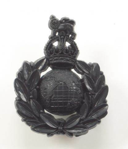 Royal Marines scarce WW2 dark blue plastic economy cap badge.