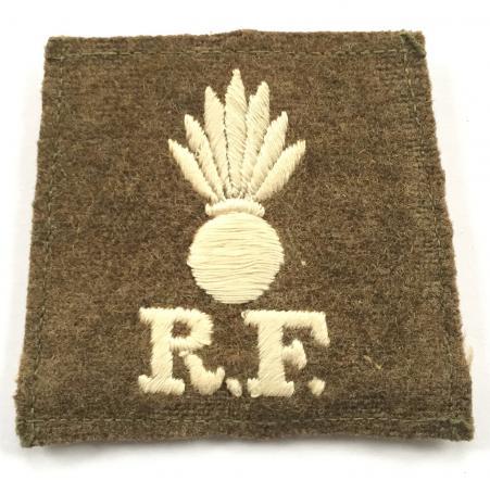 Grenade / R.F. scarce WW1 Royal Fusiliers slip-on cloth shoulder title.