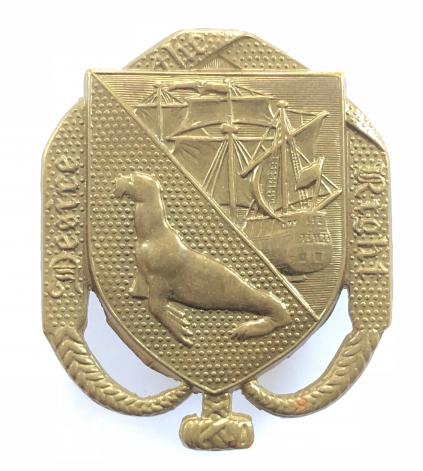 Falkland Islands Volunteer Corps die-stamped brass cap badge.