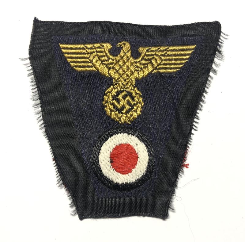 German Third Reich BeVo cloth cap badge.