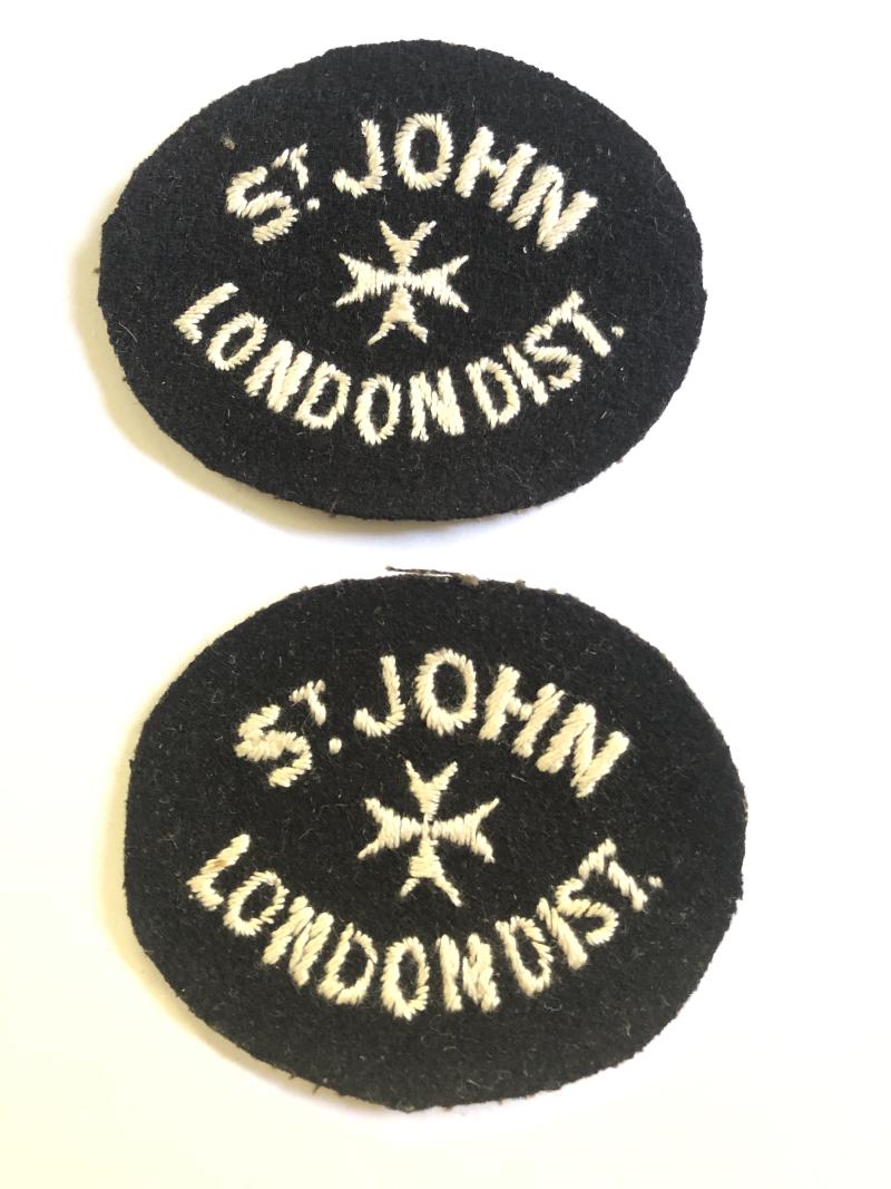 St. John London District pair of vintage shoulder titles.