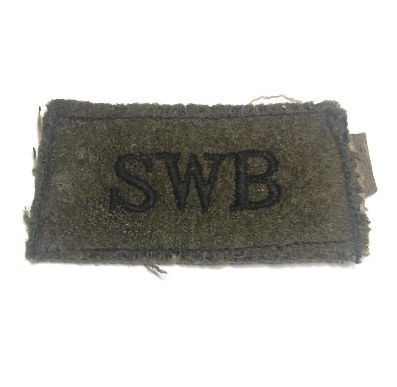 SWB WW2 South Wales Borderers slip-on shoulder title.