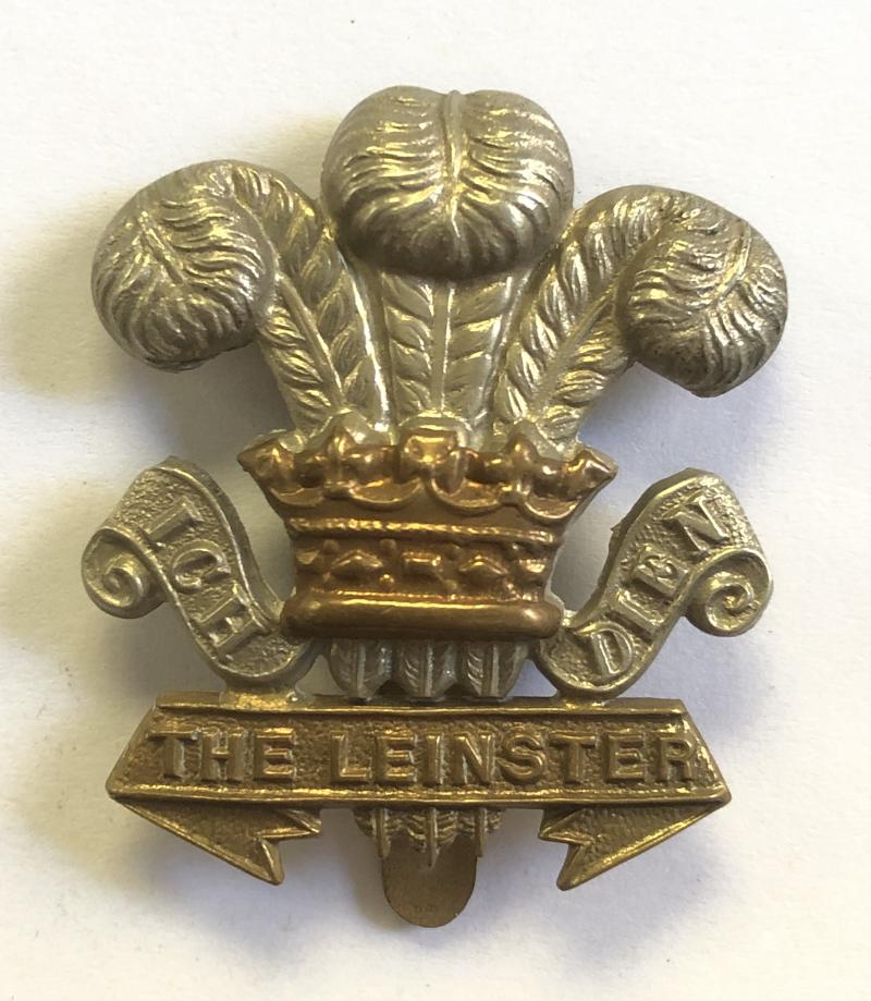 Leinster Regiment WW1 economy curled scrolls Irish bi-metal cap badge.